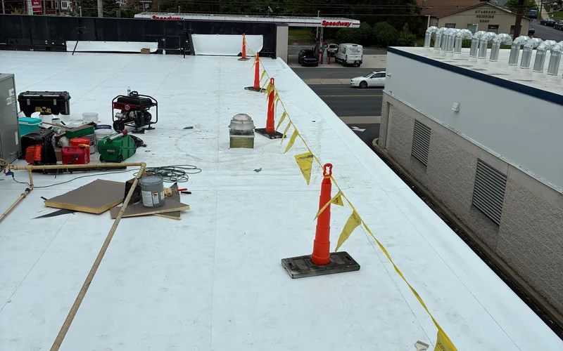 New white membrane roof being installed on a commercial building in Pennsylvania