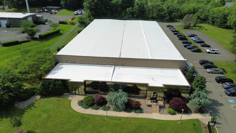 Aerial view of a completed commercial roof by Meadow Springs