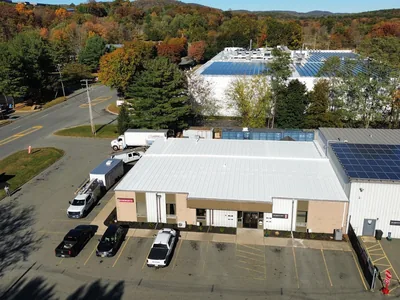 Commercial single ply membrane roof with rooftop solar array